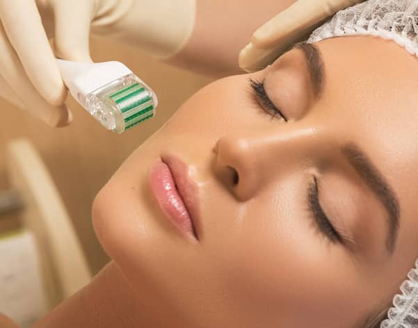 a woman`s face receives Mesotherapy treatment For Facial Skin Hydration