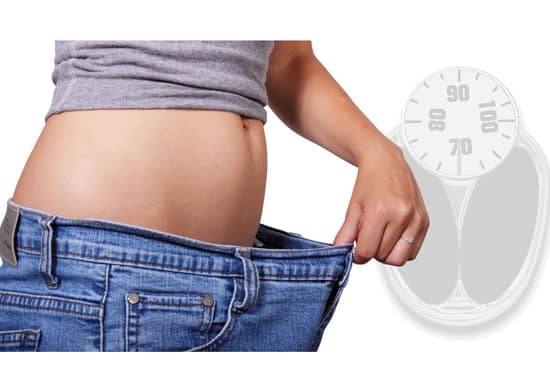 A thin stomach in wide pants shows The Effects of Dermal Fillers on Weight Loss