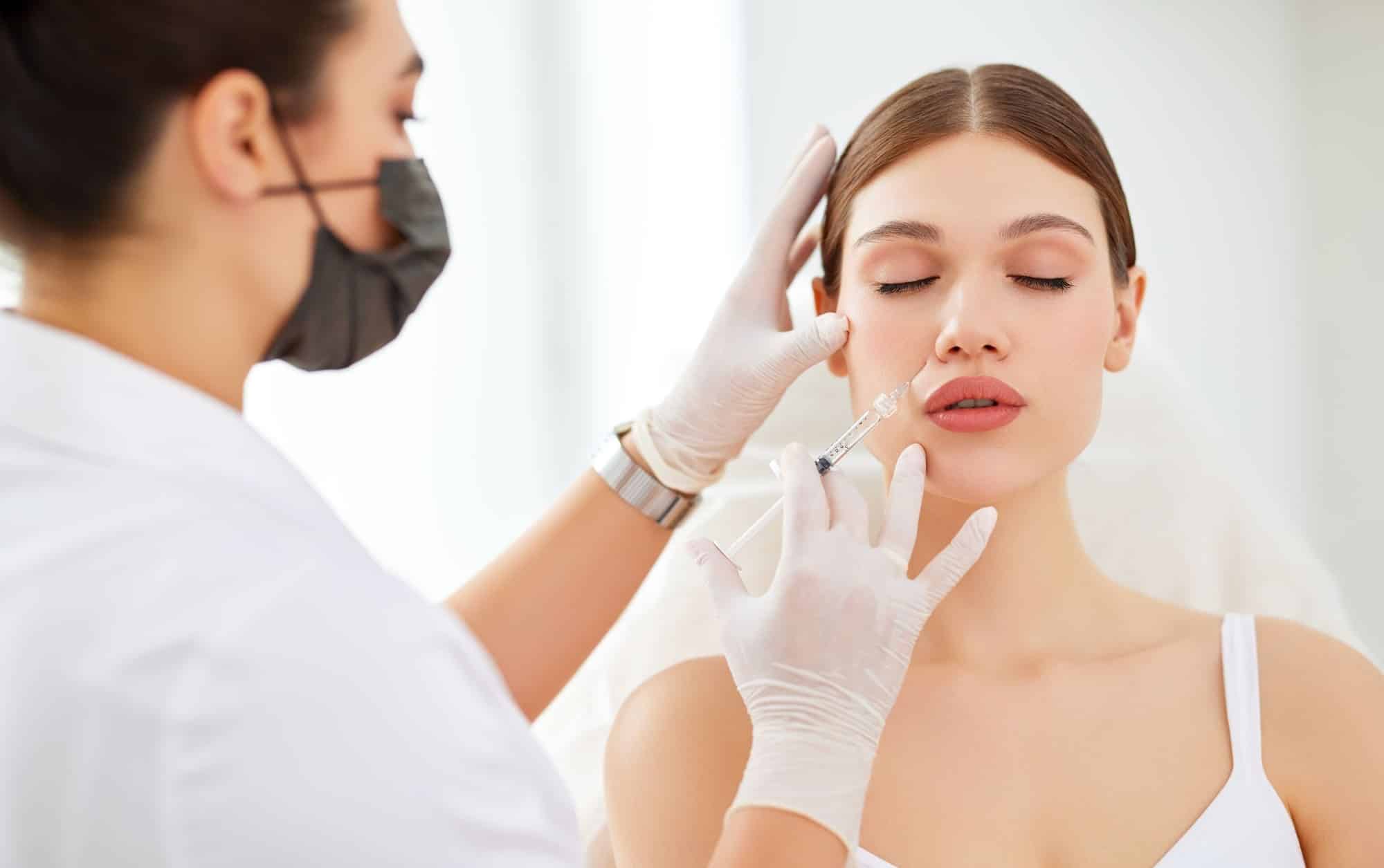 female patient and a medical professional during a botox treatment