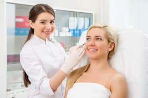 woman and a doctor in a skin treatment